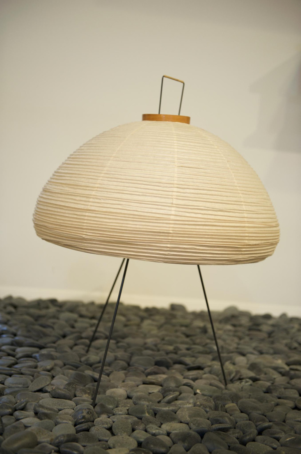 An Isamu Noguchi Akari light sculpture showing the characteristic washi paper construction and bamboo ribbing