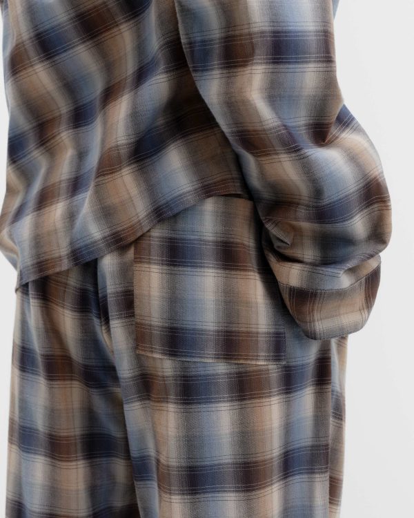 Close-up of blue and brown Dawn Checks flannel pajama pants and shirt.